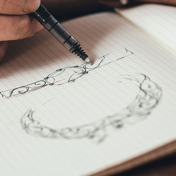 a pen drawing design of a ring on graph paper